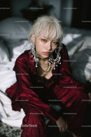 Fashionable Young Woman with Platinum Blonde Hair and Statement Jewelry