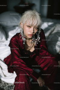 Fashionable Young Woman with Platinum Blonde Hair and Statement Jewelry