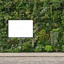 Green Vertical Garden Wall with Blank White Sign