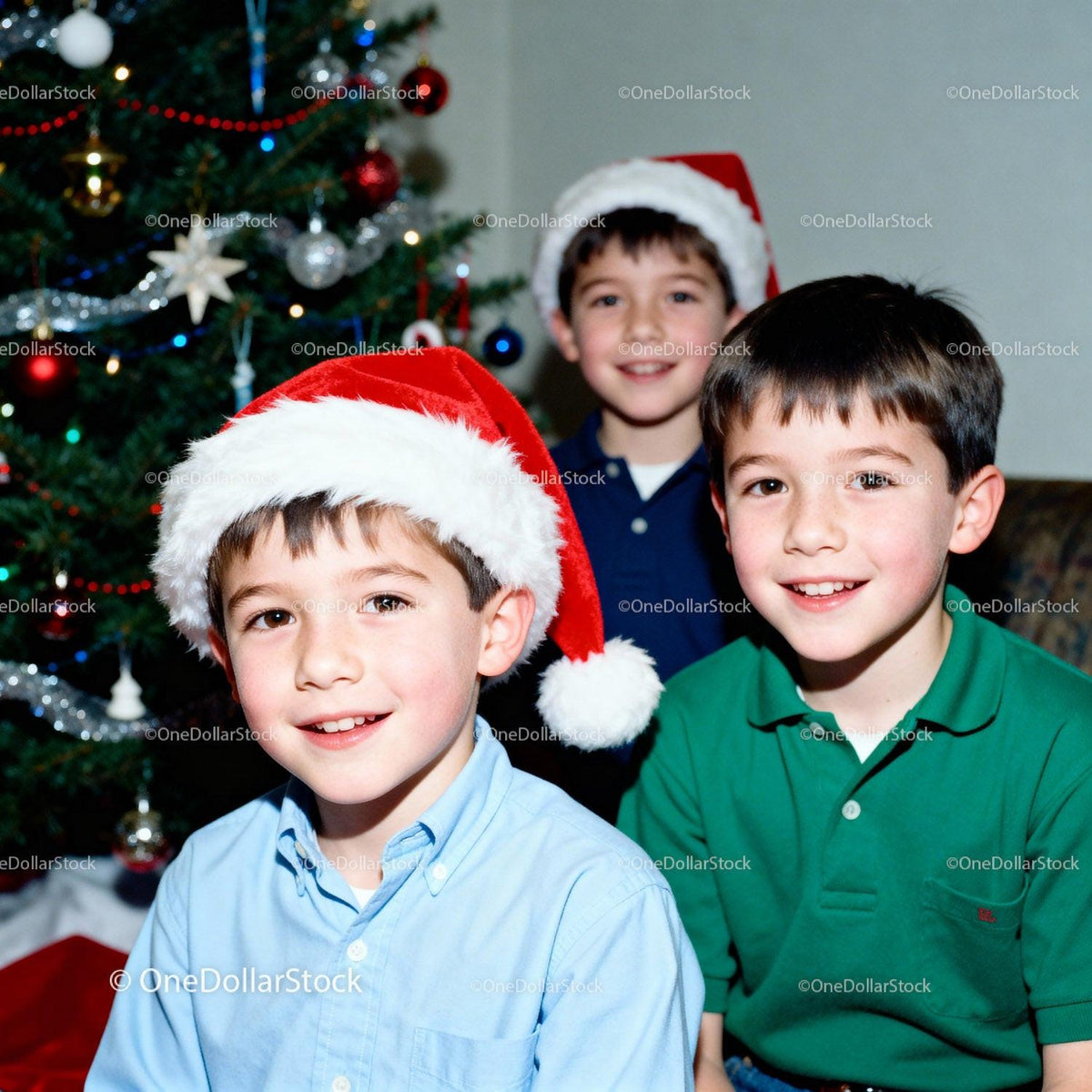 Three Boys Celebrating Christmas by Decorated Tree