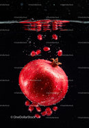 Fresh pomegranate submerged in water with seeds