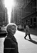 Elegant Elderly Woman Crossing City Street in Black and White