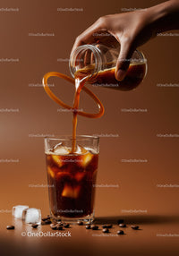 Refreshing Iced Coffee Poured from Glass Jug with Beans