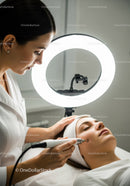 Professional Facial Treatment with Advanced Skincare Device in Beauty Clinic