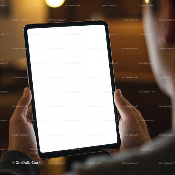 Person Holding Digital Tablet with Bright Screen Indoors JPG Mockup Image