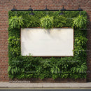 Green Nature Frame with Blank Board on Brick Wall