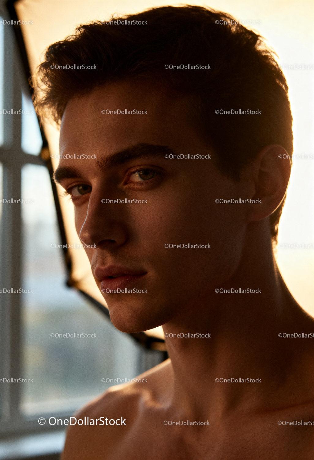 Natural light portrait of young man with calm expression