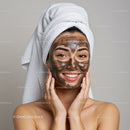 Young Woman Applying Mud Facial Mask for Skin Rejuvenation