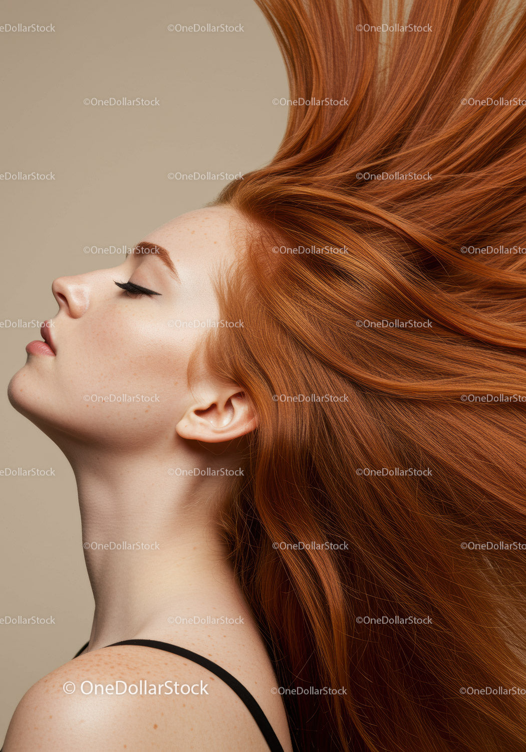 Serene woman with vibrant flowing red hair profile