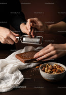 Hand Grating Dark Chocolate Over Nutty Bowl with Gourmet Ingredients