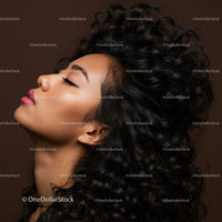 Profile of serene woman with curly black hair