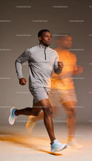 Focused man jogging indoors in light sportswear