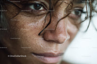 Close-up of Woman's Face with Water Droplets Showing Skin Detail