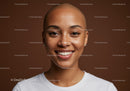 Smiling Woman with Bald Head and Natural Skin on Dark Background