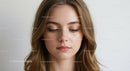 Close-up Portrait of a Young Woman with Serene Expression