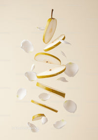 Floating Sliced Pear with Delicate White Petals