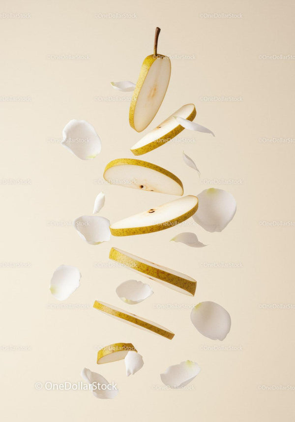 Floating Sliced Pear with Delicate White Petals