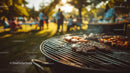 Grilled Meat and Sausages Cooking on BBQ Grill at Summer Outdoor Gathering