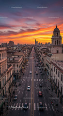 Sunset Over Downtown City Skyline with Busy Streets and Historic Building
