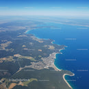 Breathtaking Aerial View of Turquoise Coastline and Lush Greenery