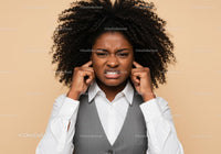 Frustrated Woman Covering Ears with Annoyed Expression