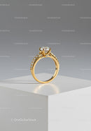 Elegant Gold Engagement Ring with Diamond Solitaire on a White Display