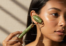 Close-Up of Woman Using Jade Roller on Face for Skincare and Facial Massage