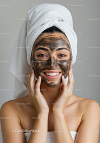 Woman Applying Mud Facial Mask for Skincare Wellness