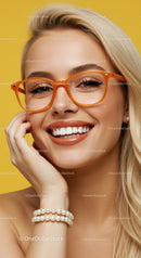 Smiling woman with orange glasses and pearl bracelet
