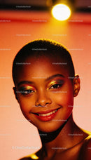 Young woman with colorful glitter makeup and bright smile