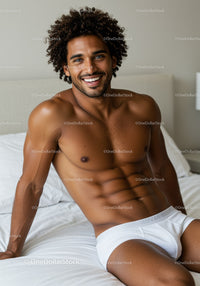 Smiling man relaxing on bed in white underwear