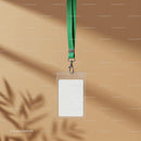 Blank ID badge with green lanyard on beige background