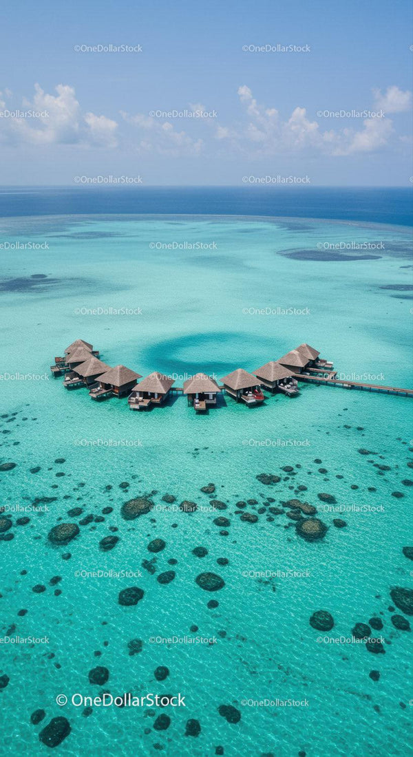 Overwater Bungalows in Turquoise Coral Reef Caribbean Paradise