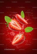 Fresh strawberry halves with mint leaves and splash