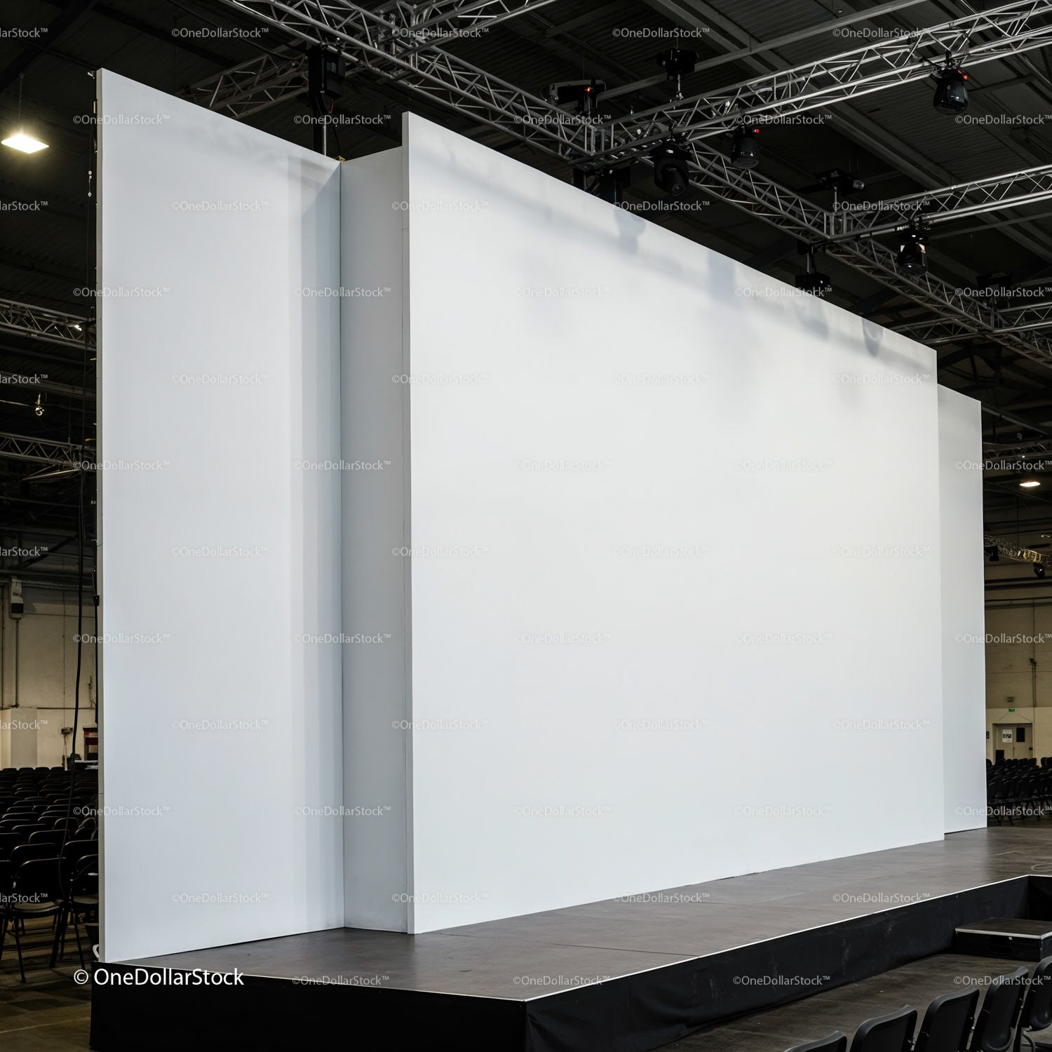 Empty white stage with large backdrops in auditorium