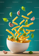 Flying fusilli pasta with garlic and fresh basil leaves