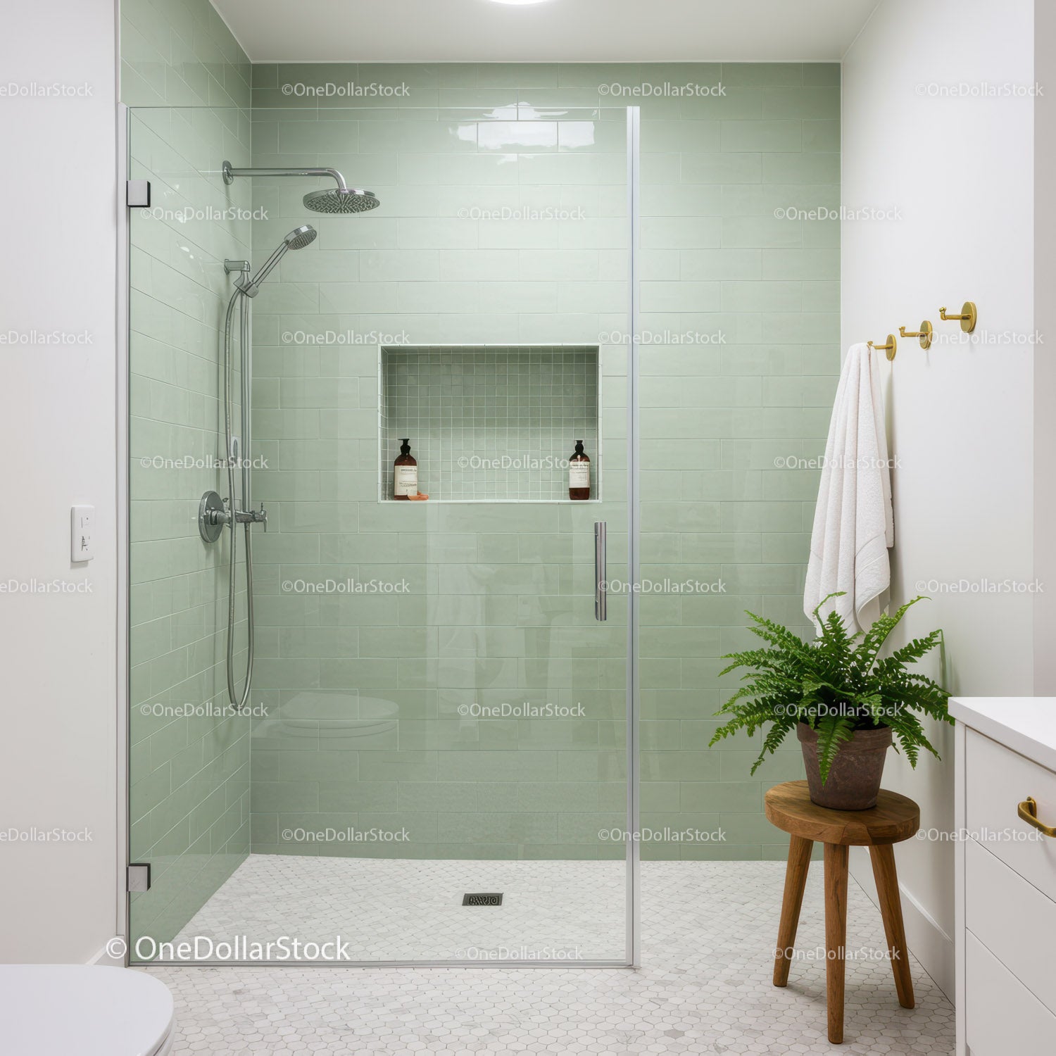 Modern bathroom with glass shower and green tiles