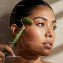 Woman Using Jade Roller for Facial Massage with Smooth Skin and Relaxed Expression
