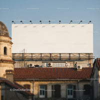 Blank Urban Billboard Above Rooftops at Sunset