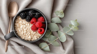 Fresh Berries and Oats in Black Ceramic Mug for Healthy Breakfast