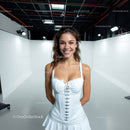 Young Woman Smiling in White Dress in Studio Photo