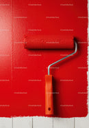 Red Paint Being Applied with Roller on White Wall for Home Renovation