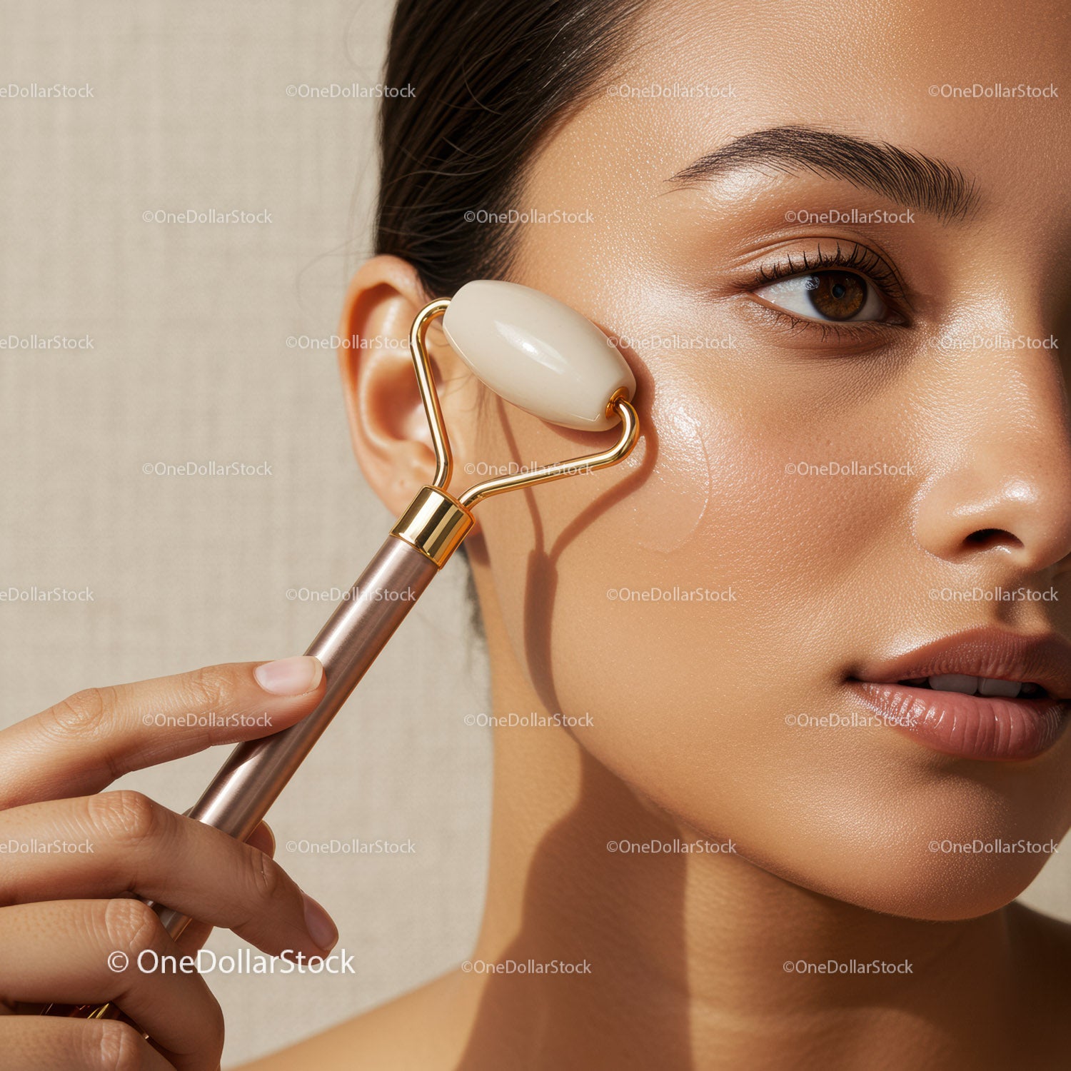 Close-Up of Woman Using Facial Roller for Skin Care Treatment