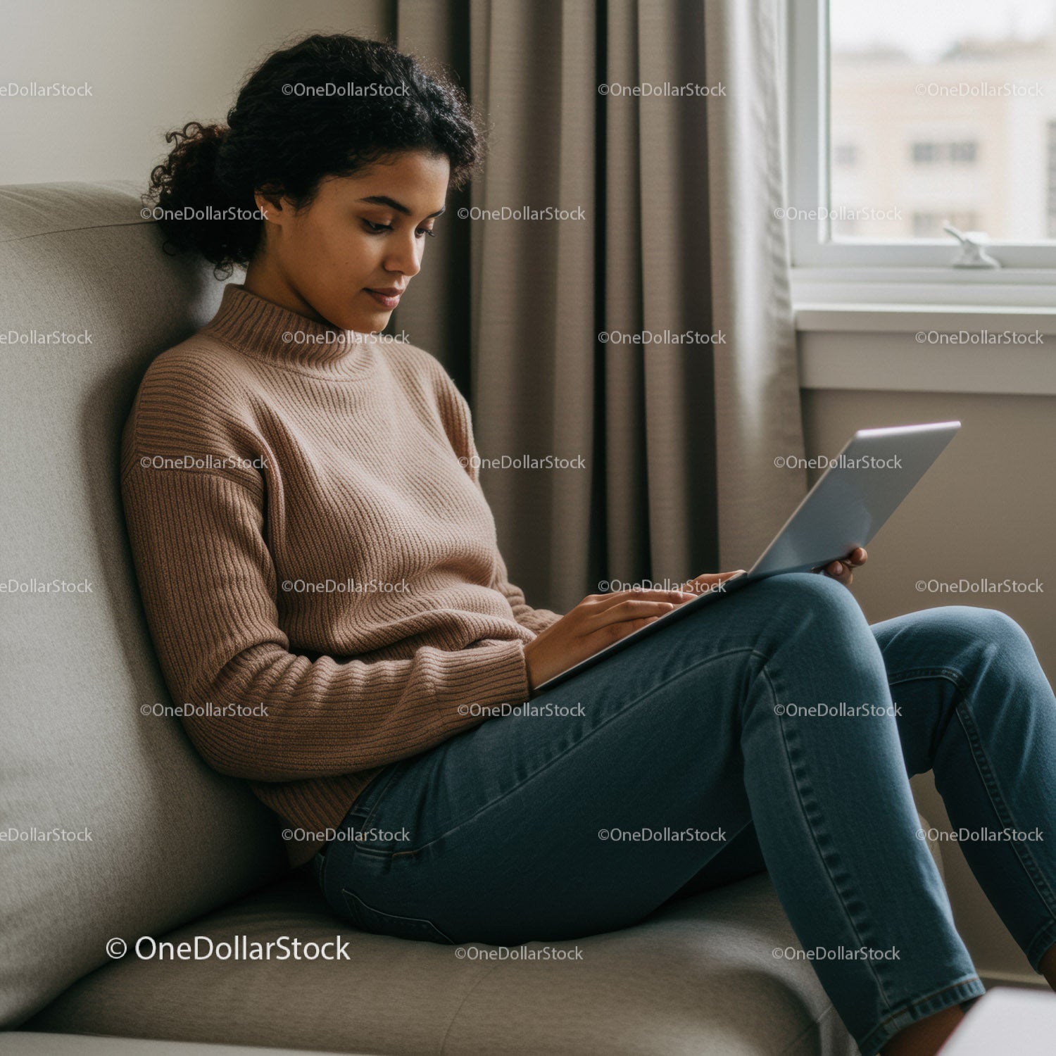 Young Woman Using Tablet on Couch in Cozy Home Setting