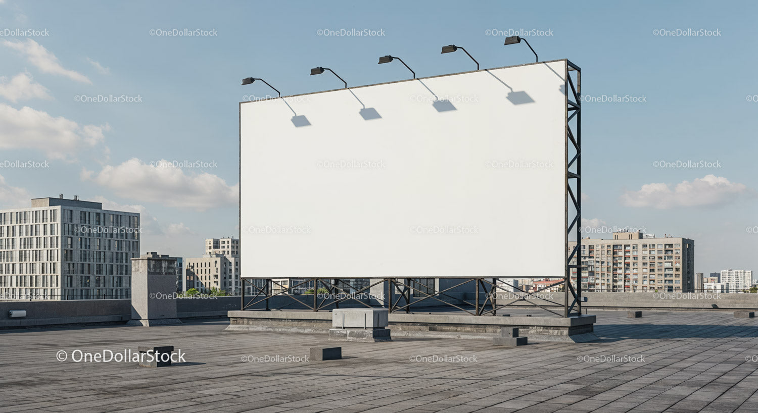 Large blank billboard on urban rooftop with city view