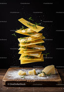 Floating lasagna sheets with cheese and fresh herbs