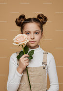 Young Girl with Pale Peach Rose Portrait on Soft Beige Background