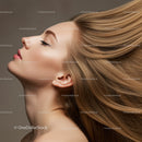 Blonde woman with flowing hair and closed eyes profile