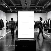 Modern clothing store with illuminated blank display board