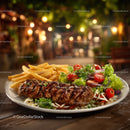 Steak with Vegetables and French Fries on Wooden Table in Warm Setting